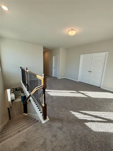 a view of a livingroom with stairs
