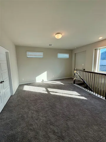 a view of livingroom and a window