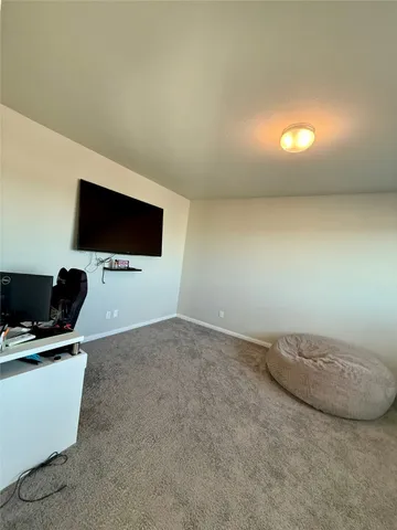 a view of a livingroom with a flat screen tv