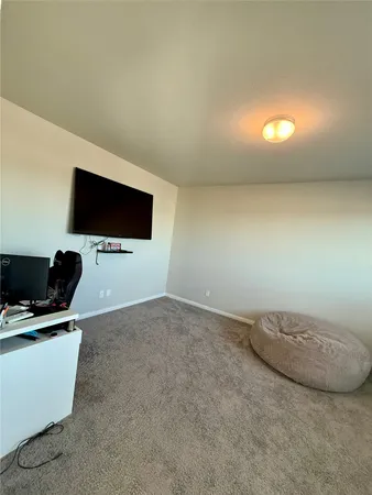 a view of a livingroom with a flat screen tv