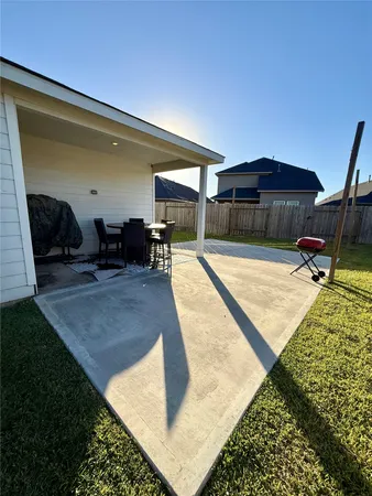 a swimming pool with outdoor seating and stairs