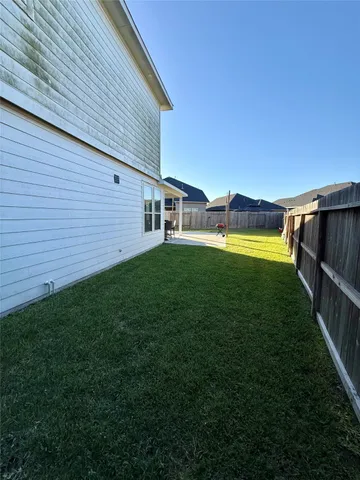 a view of a patio with a yard