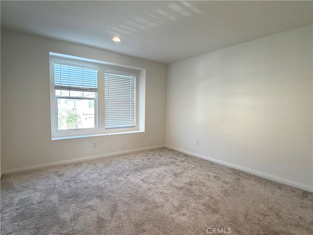 7631 Rubyred Gln Drive Riverside, CA 92507 - Photo 14 of 17 an empty room with windows