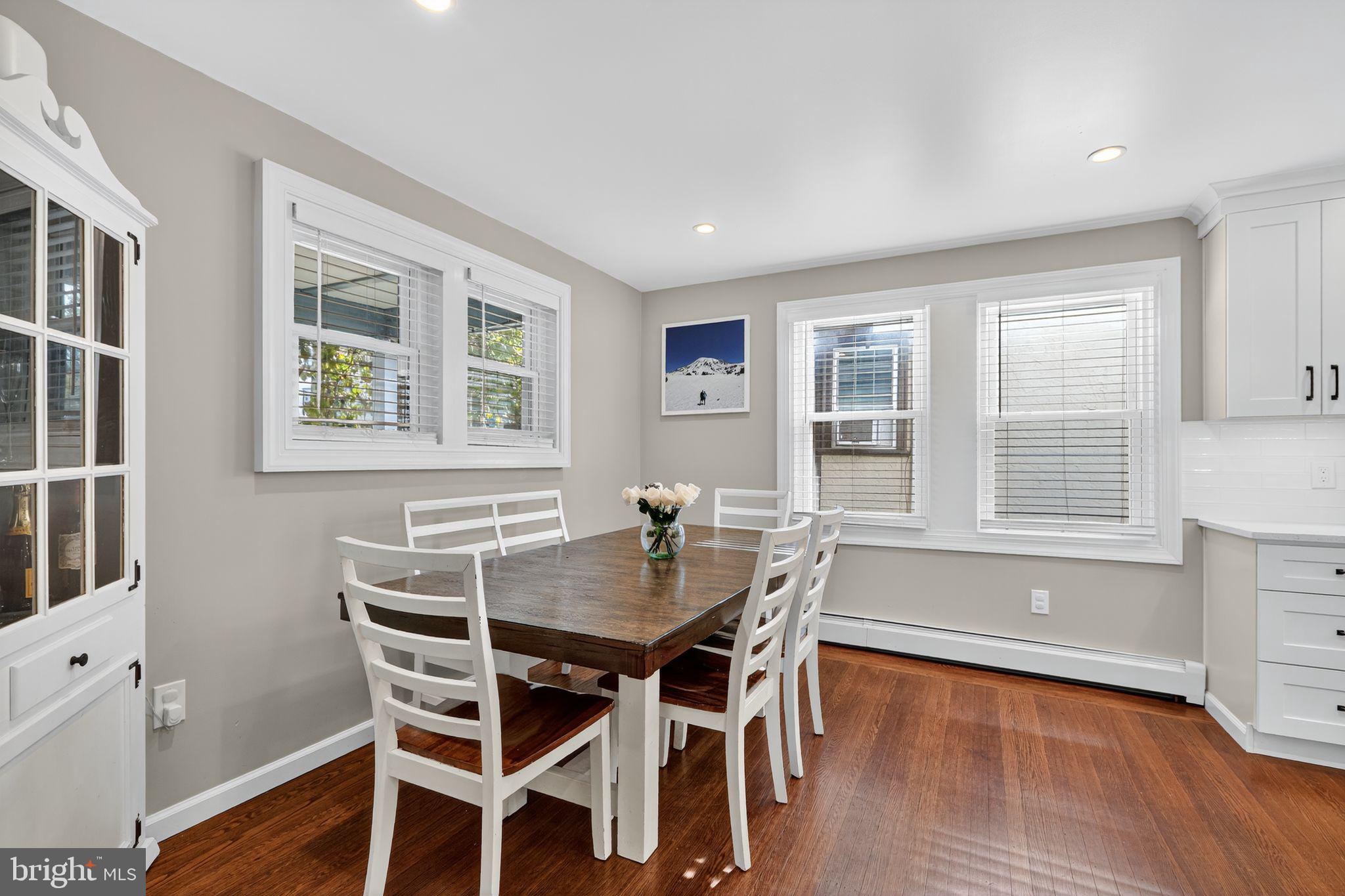 214 Lynbrooke Road Springfield, PA 19064 - Photo 18 of 42 a dining room with wooden floor and breakfast area