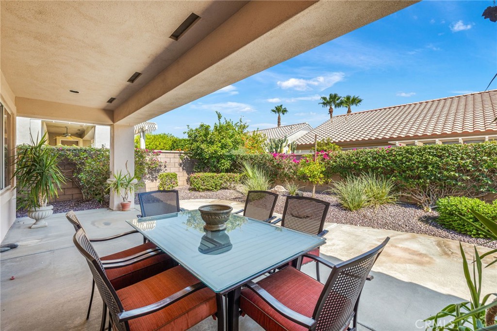 78770 Golden Reed Drive Palm Desert, CA 92211 - Photo 12 of 36 a outdoor dining space with furniture and garden view