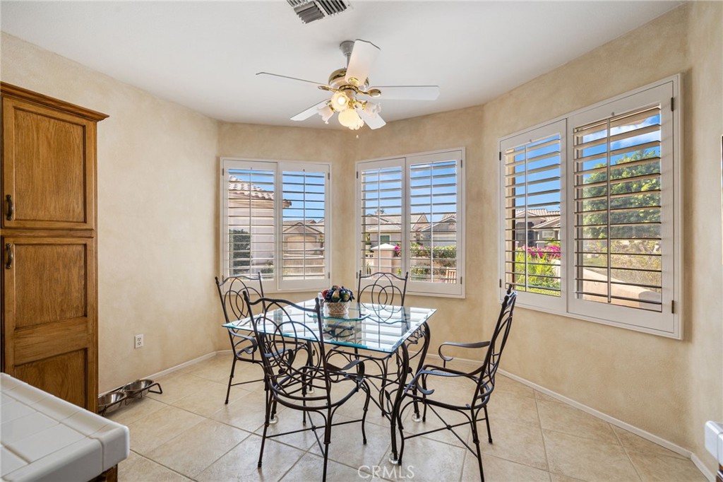 78770 Golden Reed Drive Palm Desert, CA 92211 - Photo 18 of 36 a dining room with furniture and window