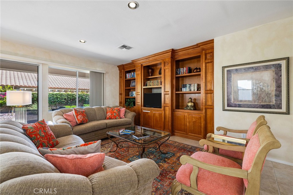 78770 Golden Reed Drive Palm Desert, CA 92211 - Photo 20 of 36 a living room with furniture and a window