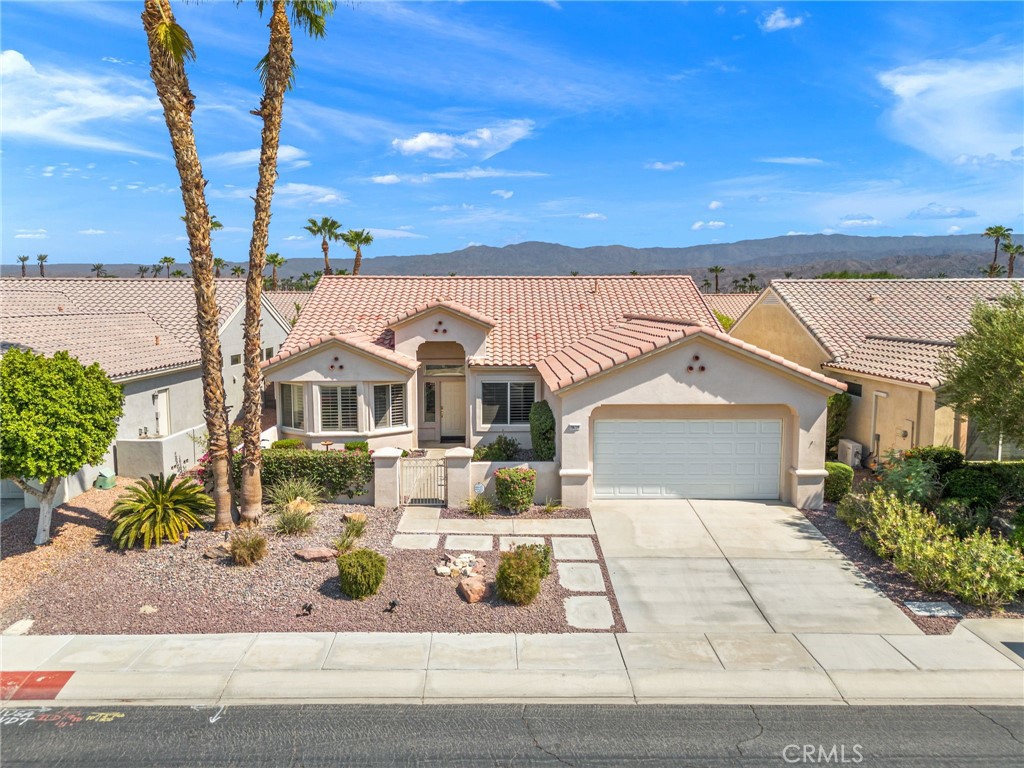 78770 Golden Reed Drive Palm Desert, CA 92211 - Photo 2 of 36 a view of a house with a yard