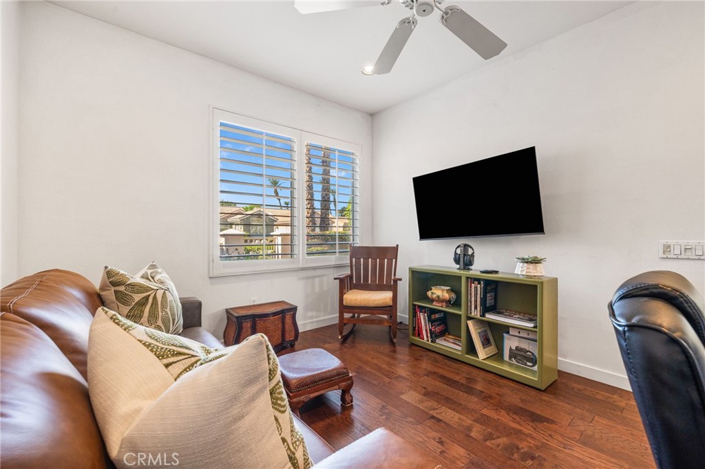 78770 Golden Reed Drive Palm Desert, CA 92211 - Photo 22 of 36 a living room with furniture and a flat screen tv