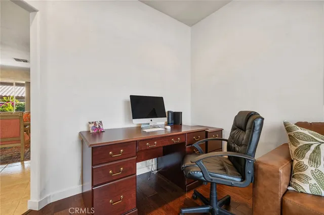 a view of a workspace with furniture