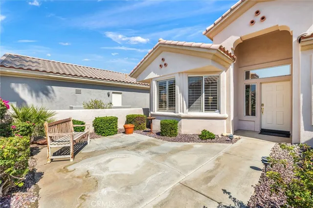 a front view of a house with a patio