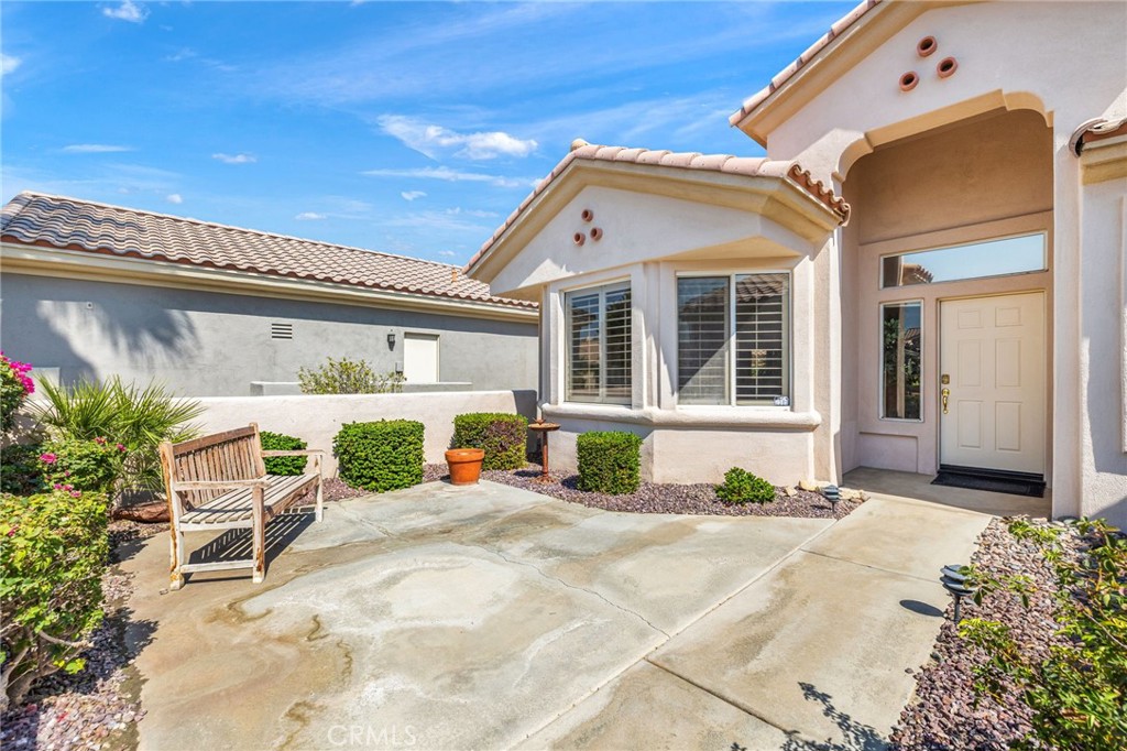 78770 Golden Reed Drive Palm Desert, CA 92211 - Photo 3 of 36 a front view of a house with a patio