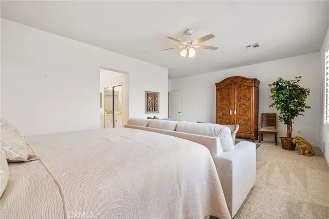 a bed room with a bed and a chandelier