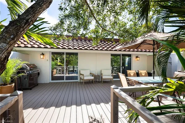 a view of a house with sitting area and furniture