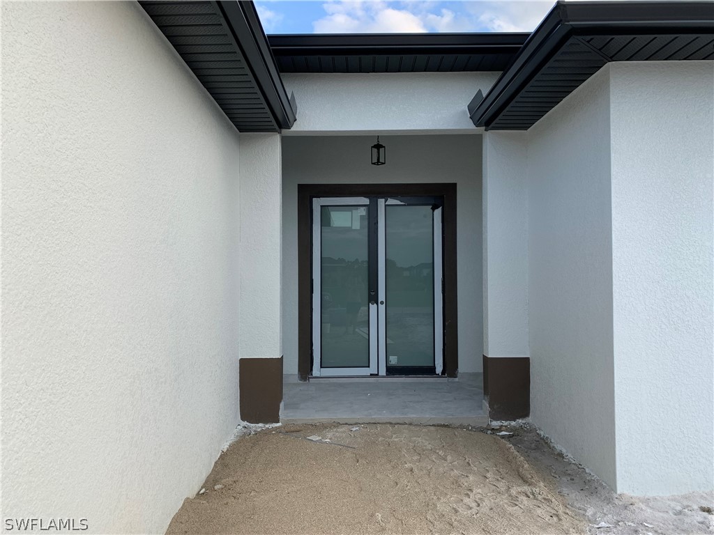 526 Raintree Street East Lehigh Acres, FL 33974 - Photo 2 of 21 a view of wooden door