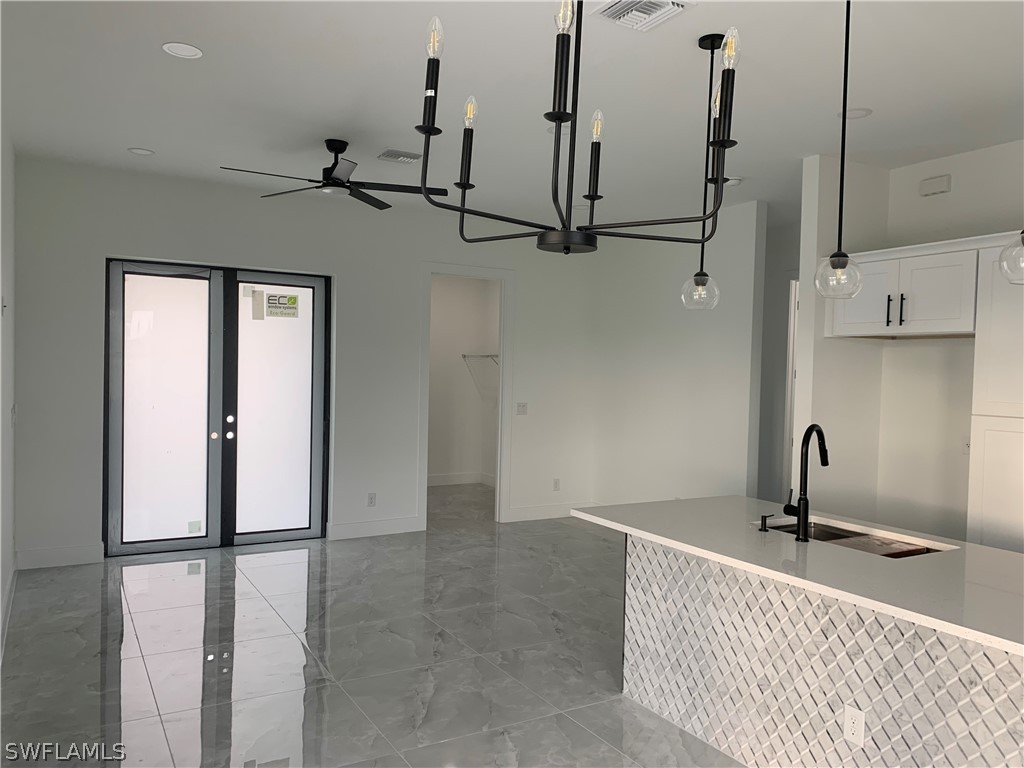 526 Raintree Street East Lehigh Acres, FL 33974 - Photo 3 of 21 a view of a bathroom with a sink