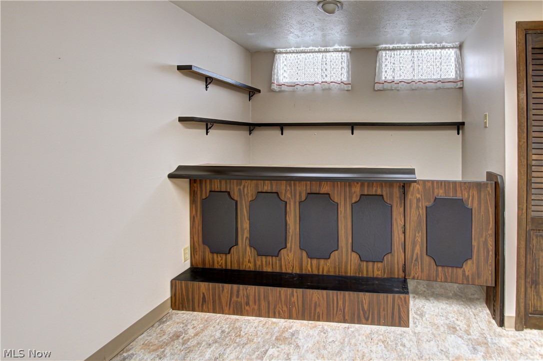 6013 Rousseau Drive Parma, OH 44129 - Photo 31 of 50 Recreation room with tile floors and bar