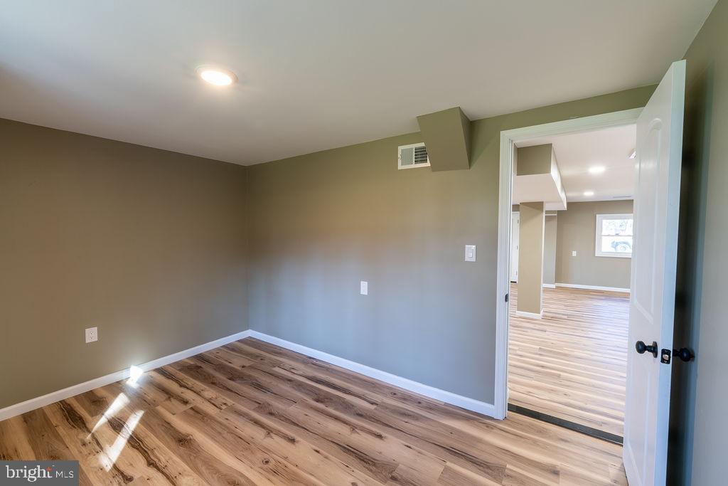 706 Center Street Kennett Square, PA 19348 - Photo 16 of 39 wooden floor in an empty room