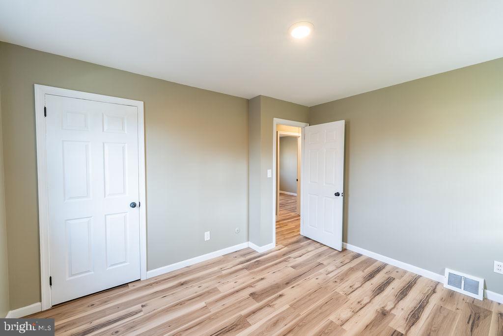 706 Center Street Kennett Square, PA 19348 - Photo 23 of 39 a view of a room with wooden floor and closet