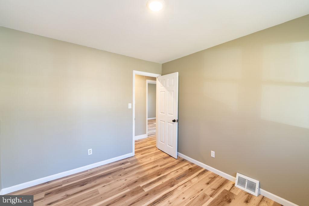 706 Center Street Kennett Square, PA 19348 - Photo 25 of 39 a view of an empty room and wooden floor