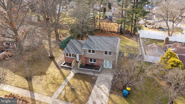 an aerial view of a house with swimming pool
