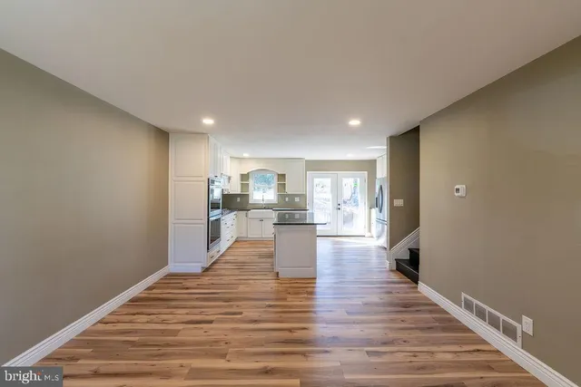 a view of a kitchen with wooden floor