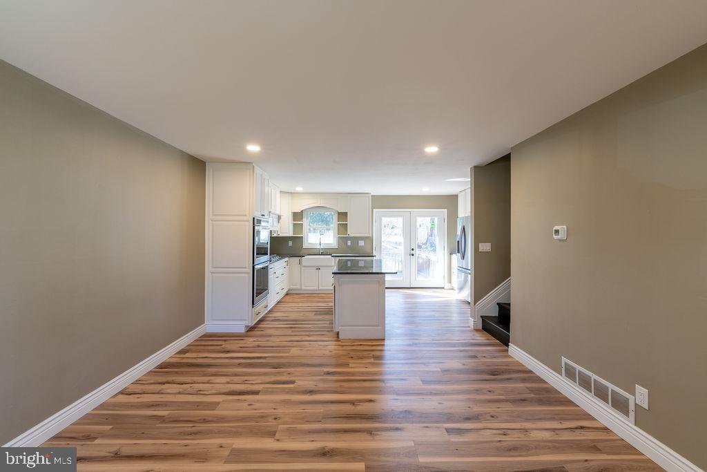 706 Center Street Kennett Square, PA 19348 - Photo 4 of 39 a view of a kitchen with wooden floor