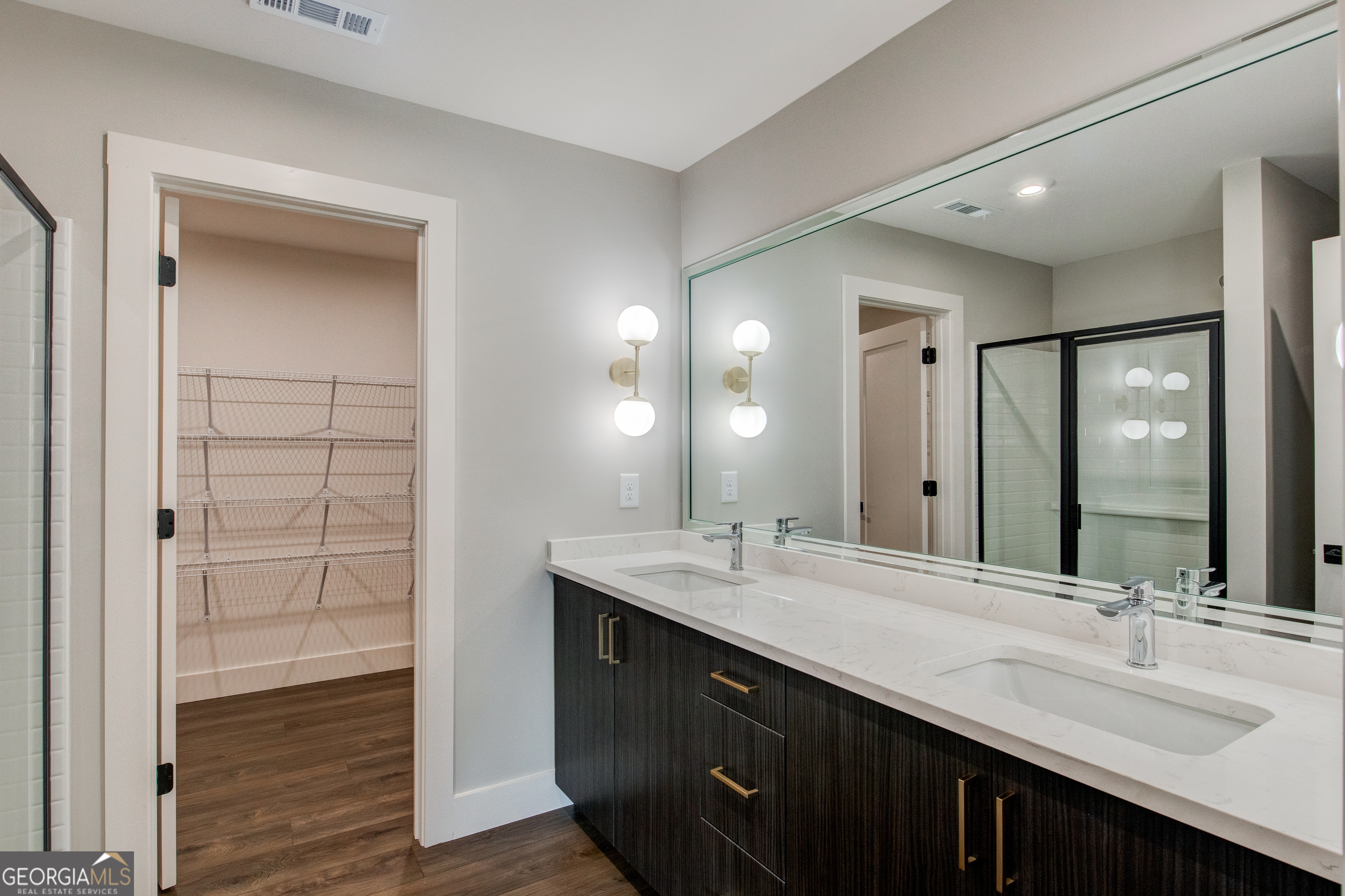 77 Chateau Drive Southeast Rome, GA 30161 - Photo 13 of 31 a bathroom with a double vanity sink and a mirror