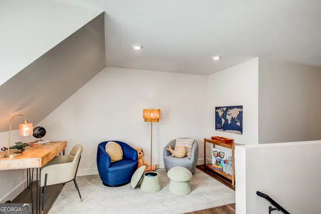 a workspace with furniture and rug