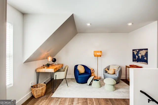 a living room with furniture and a table