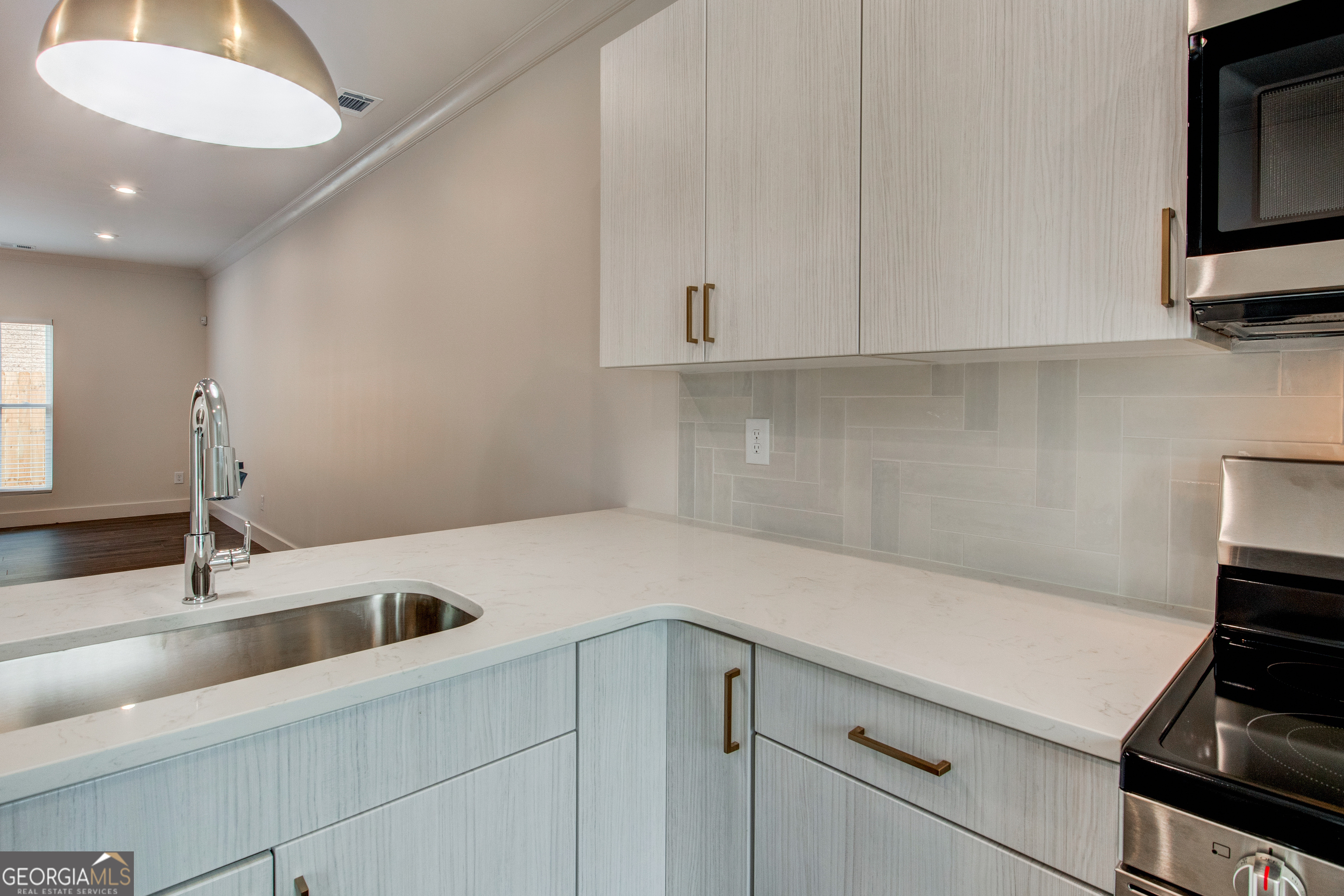 77 Chateau Drive Southeast Rome, GA 30161 - Photo 9 of 31 a kitchen with a sink and cabinets