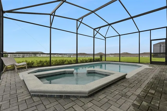 a living room with furniture and a ceiling fan