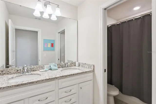 an aerial view of a residential building with an outdoor space