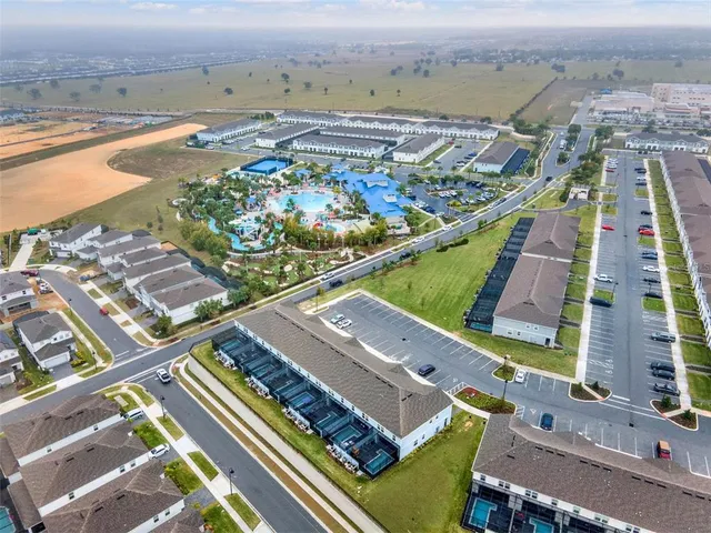 a view of house with a garden and deck