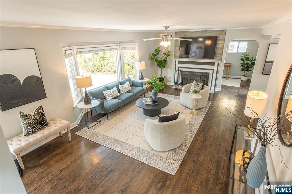 1169 Broad Street Bloomfield, NJ 07003 - Photo 11 of 47 a living room with fireplace furniture and a wooden floor