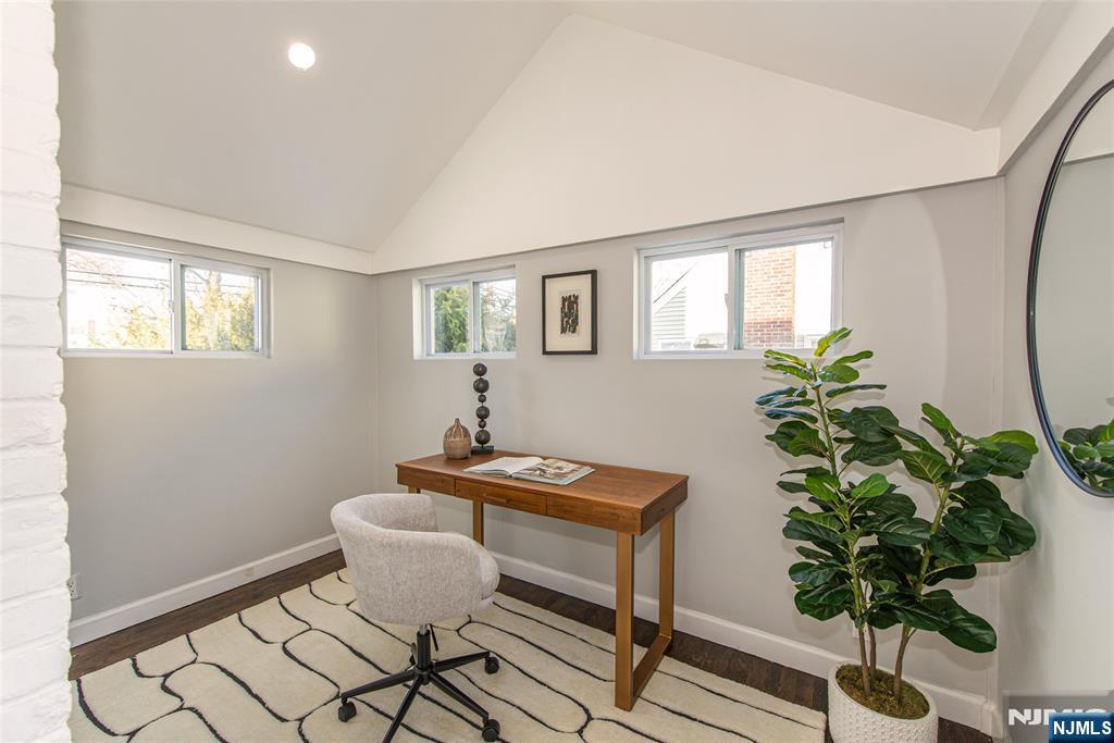 1169 Broad Street Bloomfield, NJ 07003 - Photo 16 of 47 a room with furniture and a potted plant