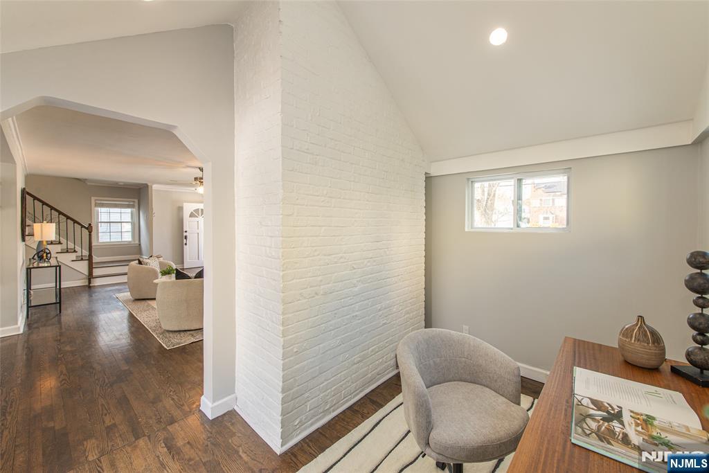 1169 Broad Street Bloomfield, NJ 07003 - Photo 18 of 47 a room with furniture and a wooden floor