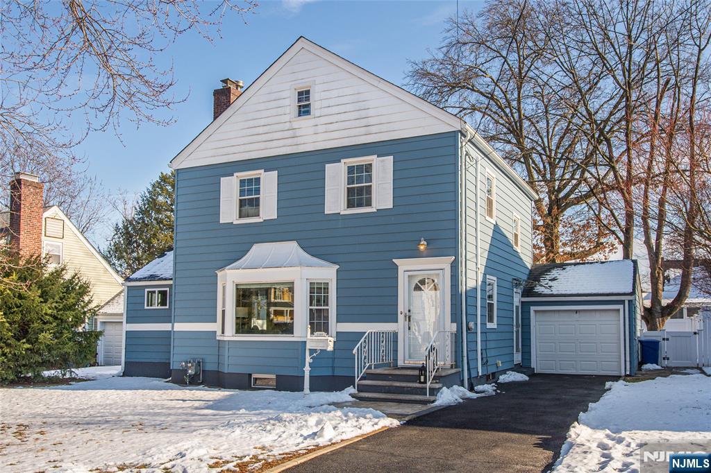 1169 Broad Street Bloomfield, NJ 07003 - Photo 2 of 47 a front view of a house with a yard