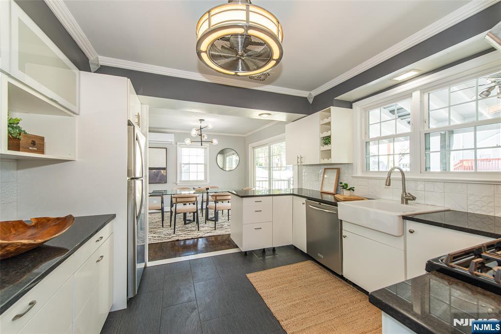 1169 Broad Street Bloomfield, NJ 07003 - Photo 22 of 47 a kitchen with a stove oven and a sink