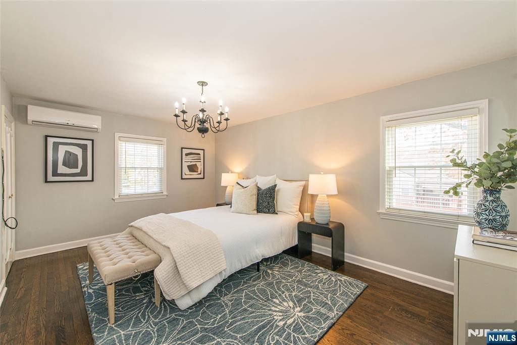 1169 Broad Street Bloomfield, NJ 07003 - Photo 26 of 47 a bedroom with a bed and wooden floor