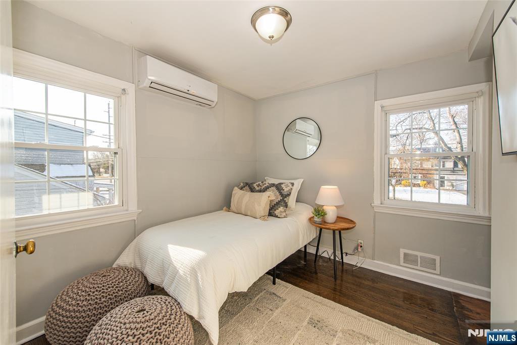 1169 Broad Street Bloomfield, NJ 07003 - Photo 29 of 47 a bedroom with a bed and a window