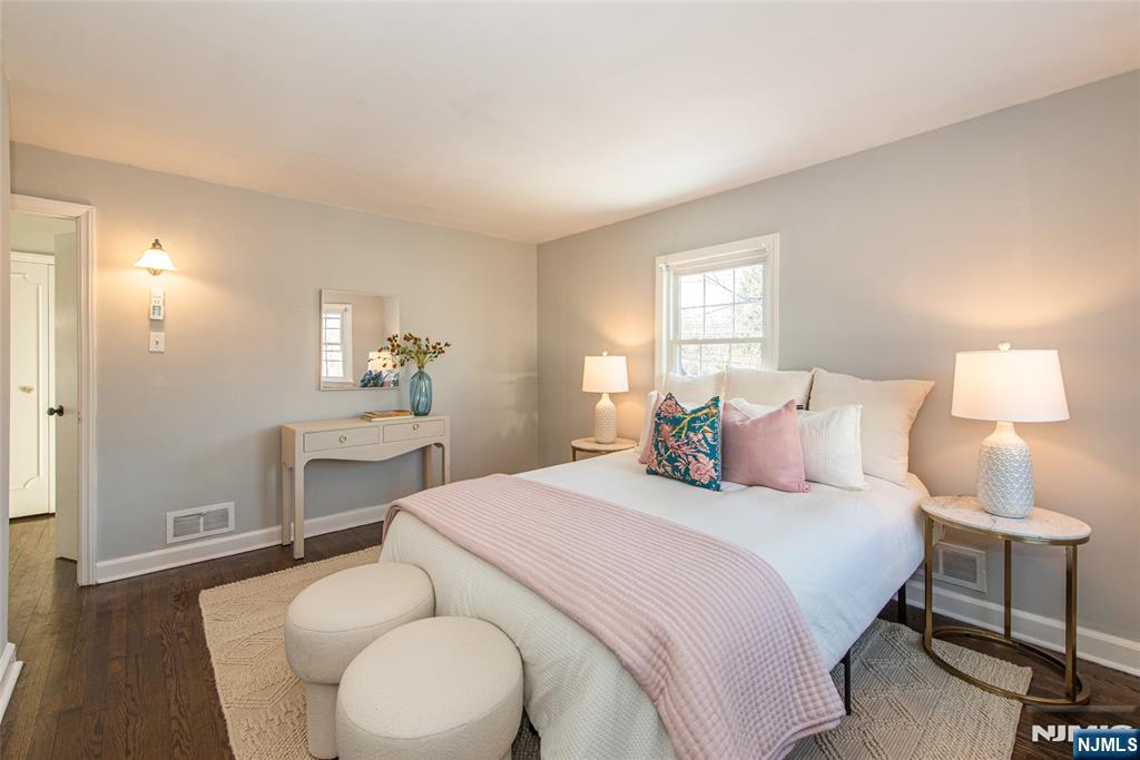 1169 Broad Street Bloomfield, NJ 07003 - Photo 30 of 47 a bedroom with a bed and a lamp