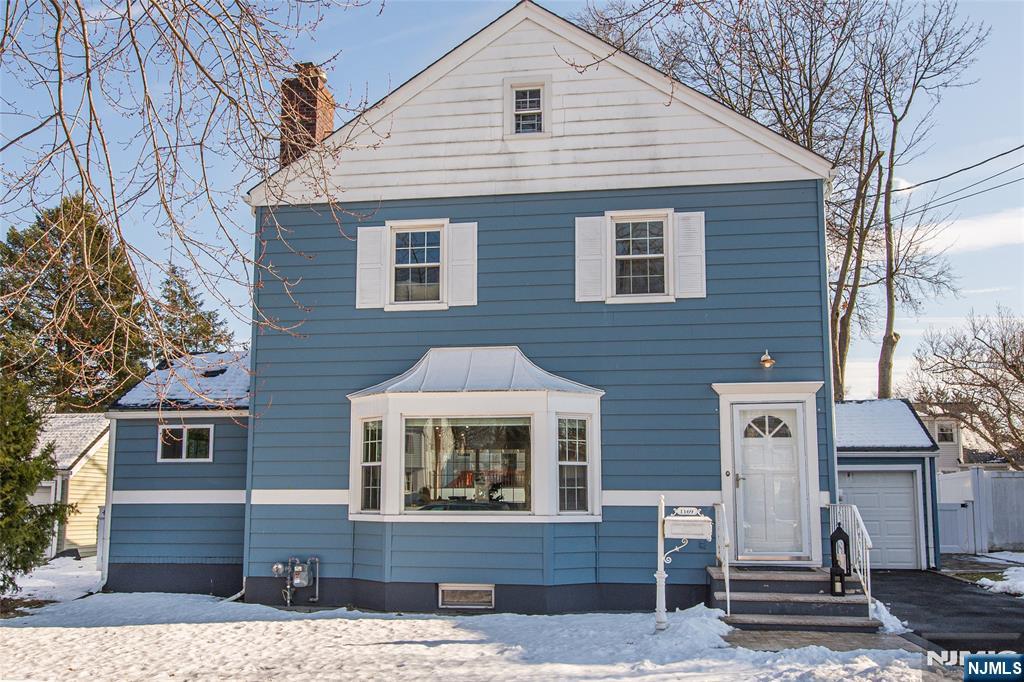 1169 Broad Street Bloomfield, NJ 07003 - Photo 3 of 47 a front view of a house with a yard