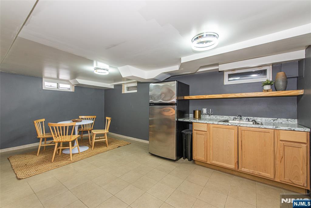 1169 Broad Street Bloomfield, NJ 07003 - Photo 39 of 47 a kitchen with stainless steel appliances granite countertop a sink and a refrigerator