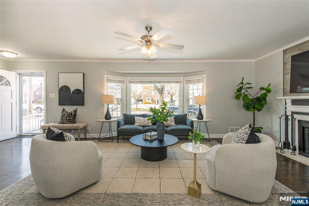 1169 Broad Street Bloomfield, NJ 07003 - Photo 6 of 47 a living room with furniture potted plant and window