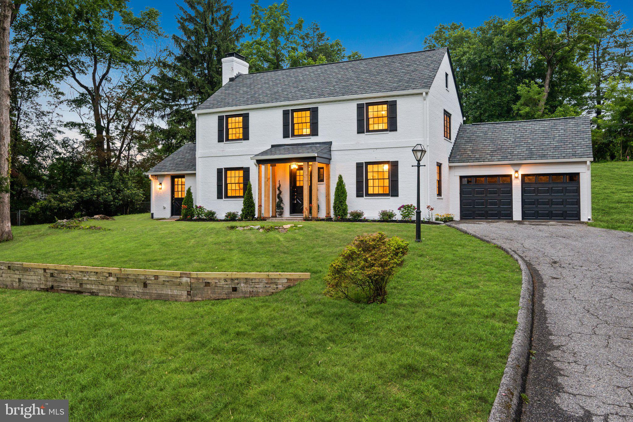 7819 Overbrook Road Ruxton, MD 21204 - Photo 1 of 80 a front view of a house with a yard and garage