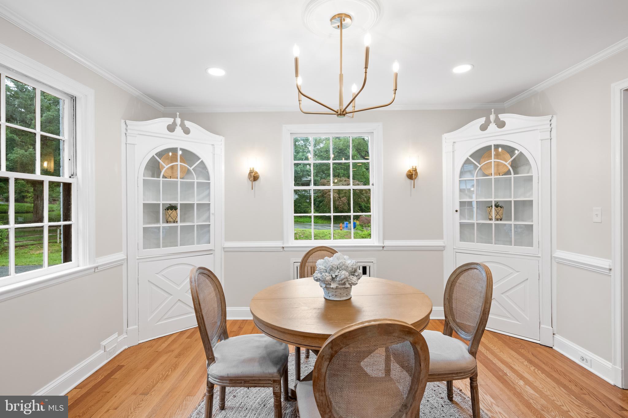 7819 Overbrook Road Ruxton, MD 21204 - Photo 13 of 80 a view of a dining room with furniture a chandelier and wooden floor