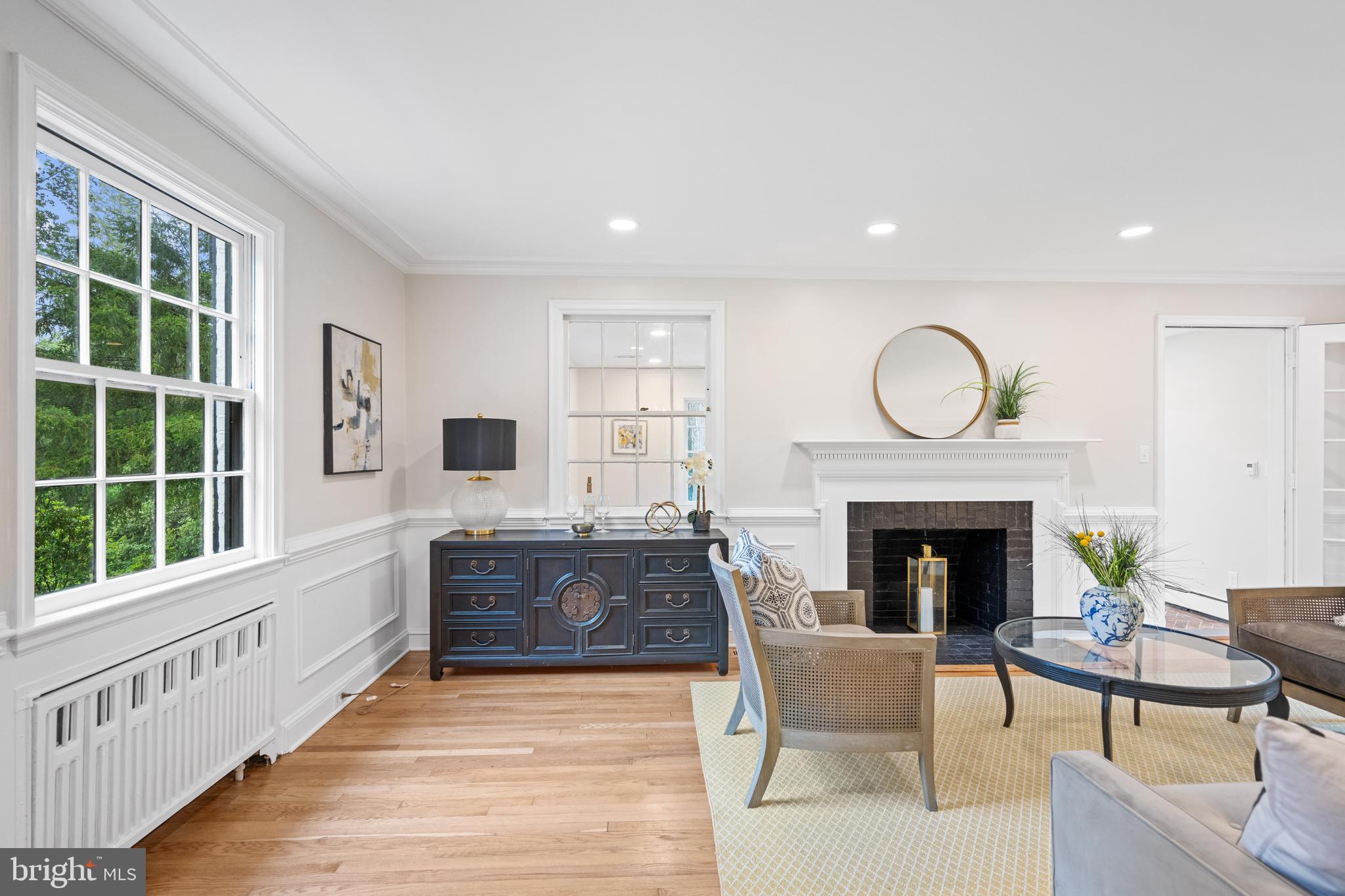 7819 Overbrook Road Ruxton, MD 21204 - Photo 27 of 80 a living room with furniture a fireplace and a flat screen tv