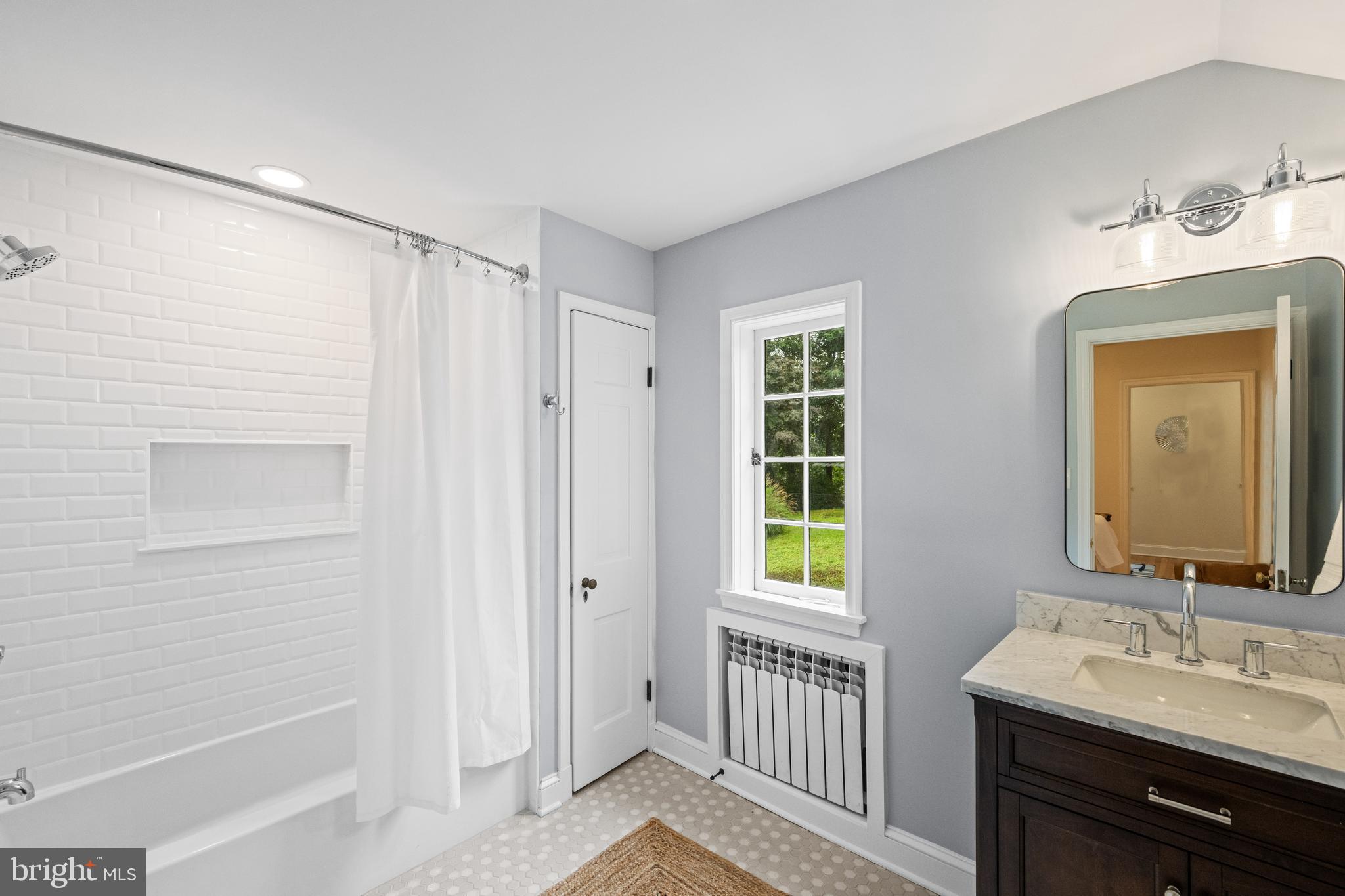7819 Overbrook Road Ruxton, MD 21204 - Photo 50 of 80 a bathroom with a sink a mirror and a shower