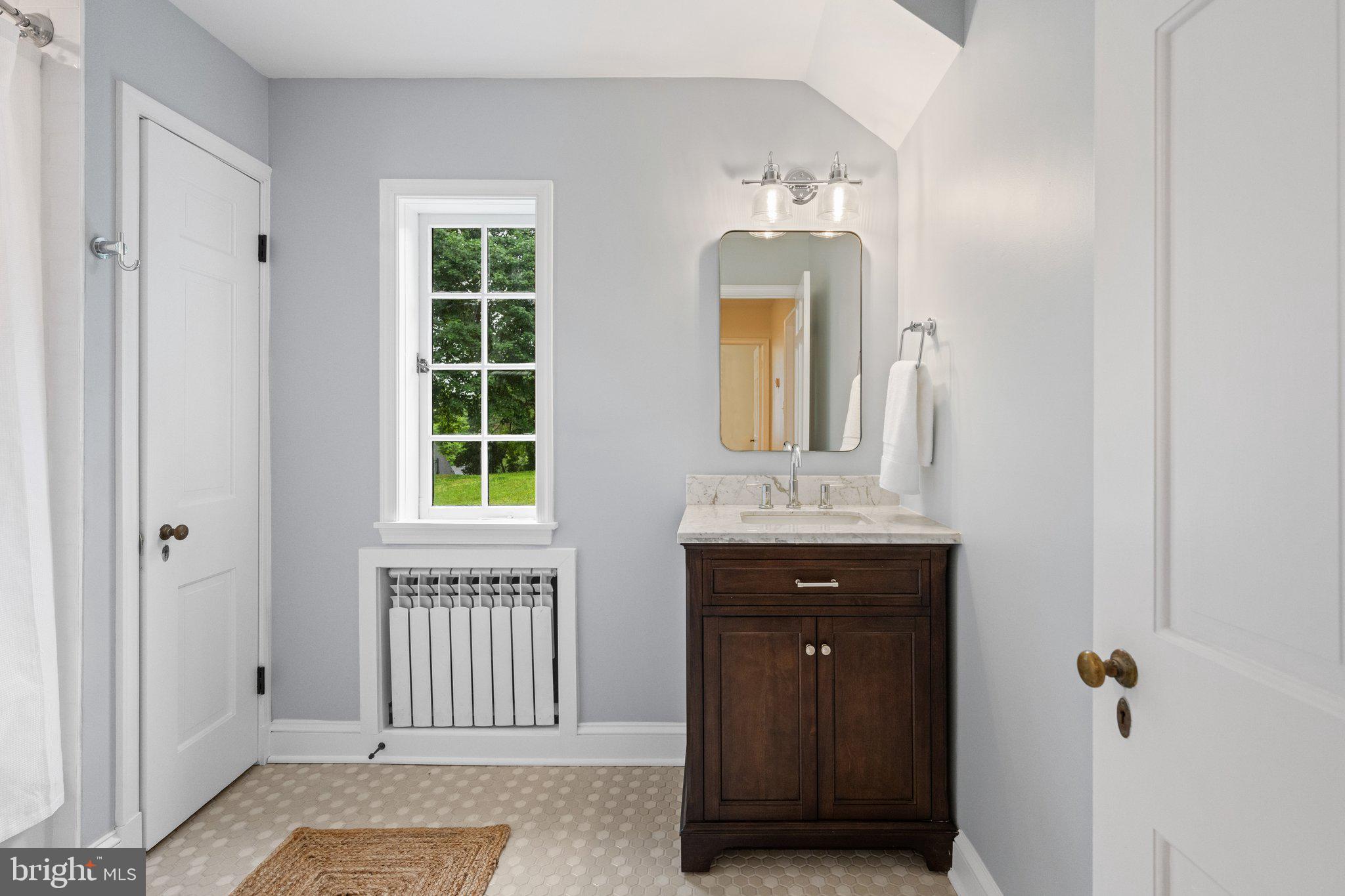 7819 Overbrook Road Ruxton, MD 21204 - Photo 51 of 80 a bathroom with a granite countertop sink and a mirror